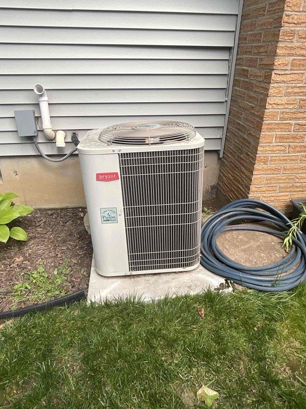 Responded to no cooling complaint on residential air conditioning system. Upon inspection, found 23-year-old outdoor condensing unit that was originally installed in 2003. Evaluated complete HVAC system including outdoor condenser unit and indoor components in basement utility area. Due to age of equipment and whole-house cooling failure, provided comprehensive estimate for full system replacement including new air conditioning unit, compatible indoor air handler/furnace, refrigerant lines, electrical connections, and thermostat controls to restore reliable climate control throughout the residence.