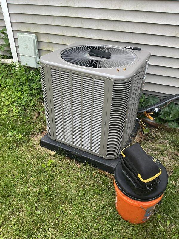 Performed annual cooling maintenance on residential air conditioning system. Conducted comprehensive inspection of outdoor condenser unit, checked refrigerant pressures and levels using manifold gauges, cleaned condenser coils, verified proper airflow through louvers, inspected electrical connections and safety labels, and confirmed unit operational status. All components found operating within manufacturer specifications with no issues identified.