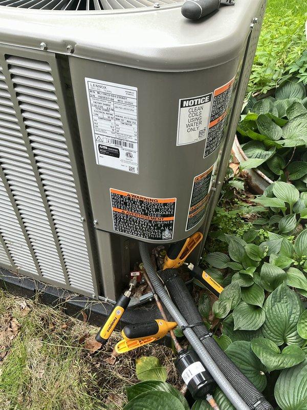 Performed annual cooling maintenance on residential air conditioning system. Conducted comprehensive inspection of outdoor condenser unit, checked refrigerant pressures and levels using manifold gauges, cleaned condenser coils, verified proper airflow through louvers, inspected electrical connections and safety labels, and confirmed unit operational status. All components found operating within manufacturer specifications with no issues identified.