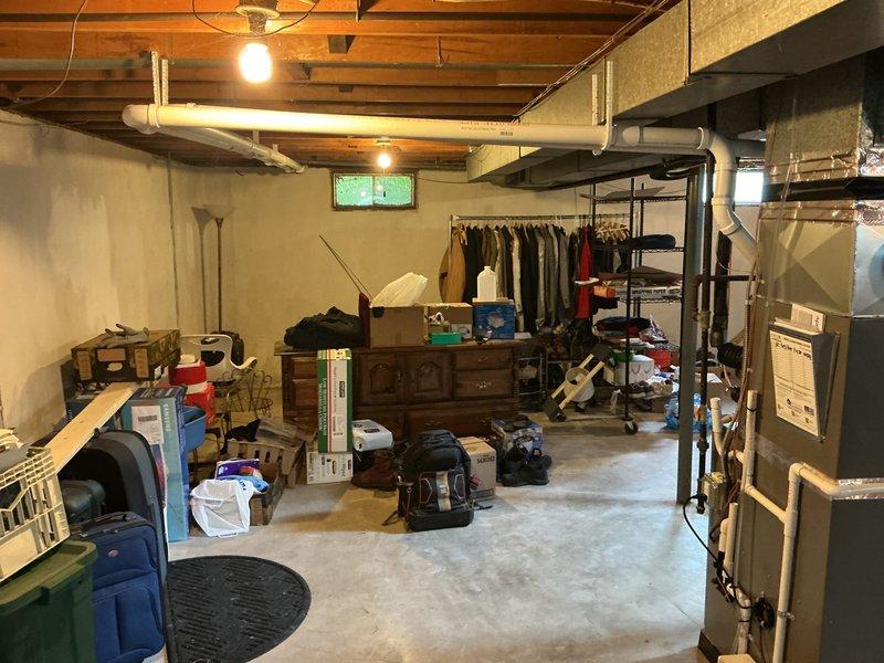 Completed full HVAC system installation in basement mechanical room, including 70,000 BTU gas furnace with left-side configuration and 2-ton air conditioning unit. Installed humidifier, connected all ductwork with metallic flex ducting, and reconnected existing electrical and gas lines. All permits obtained prior to installation, system tested and verified operational upon completion.