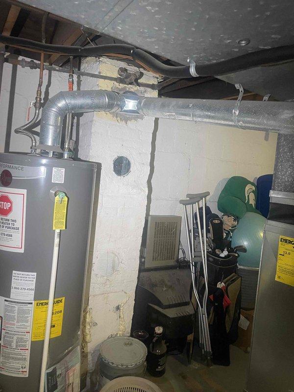 Conducted comprehensive HVAC system evaluation in basement mechanical room for complete system replacement estimate. Customer requesting replacement within one month timeframe. Assessed existing equipment configuration including current heating and cooling components, ductwork layout, and mechanical connections. Documented existing installation with detailed photography showing water heater placement, ductwork routing through exposed ceiling joists, floor register locations, and available workspace for equipment replacement. Evaluated electrical supply, condensate drainage provisions, and existing refrigerant line routing. Provided detailed replacement estimate for single component HVAC system with installation specifications tailored to existing mechanical room layout and customer's replacement-only requirements.