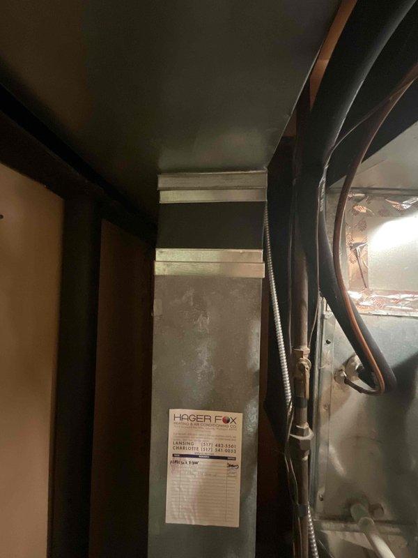 Performed on-site evaluation and provided replacement estimate for 18-year-old furnace and air conditioning system. Assessed existing indoor air handler unit with vertical duct configuration in mechanical closet and outdoor condenser unit positioned on concrete pad against exterior wall. Both units operating without current malfunctions but nearing end of expected service life, prompting homeowner to request replacement quotation for upgraded HVAC equipment.