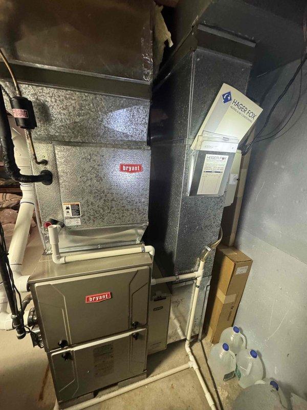 Completed estimate for replacement of forty-year-old air conditioning system located in basement. Assessed existing Bryant furnace and air handler configuration, evaluated electrical panel capacity and circuit availability for new AC installation. Documented current HVAC setup including ductwork connections, condensate drainage system, and electrical service requirements to provide accurate replacement quote for expedited installation.