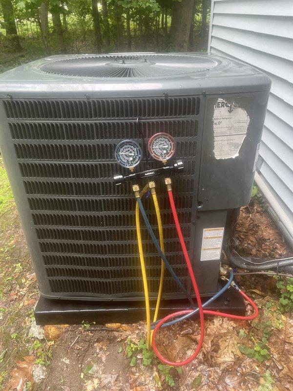 Completed annual cooling maintenance on residential air conditioning system. Performed comprehensive inspection of outdoor condensing unit, checked refrigerant pressures using manifold gauge set, verified proper system operation, and documented equipment condition with photos. Unit found to be operating within normal parameters with no issues identified during preventative maintenance visit.