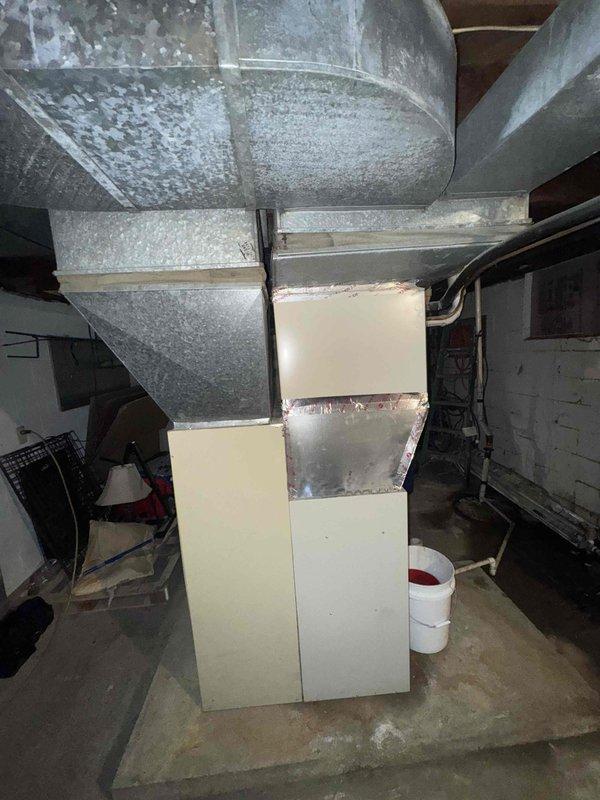 Conducted comprehensive assessment of non-functional residential HVAC system for full replacement estimate. Evaluated aging outdoor AC unit of unknown age and approximately 14-year-old furnace located in basement. Documented existing equipment conditions, ductwork configuration showing significant condensation accumulation on metallic supply ducts, and overall system layout. Photographed furnace, air handler, basement mechanical room setup, and associated ductwork to provide complete system documentation for replacement proposal. Provided customer with equipment options and specifications for complete heating and cooling system replacement to restore climate control functionality to residence.