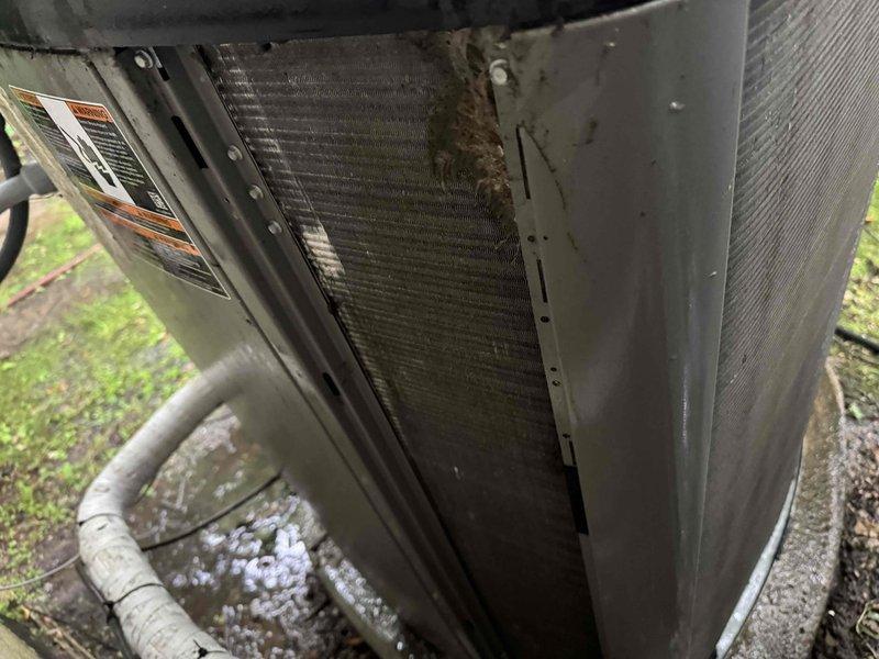 Responded to callback for 7-year-old Lennox AC system with complete failure to operate. Upon arrival, performed diagnostic inspection of outdoor condenser unit and discovered heavy dirt and debris accumulation on condenser coils, significantly restricting airflow and heat transfer capability. Thoroughly cleaned condenser coils to remove caked-on mud and debris buildup. Inspected refrigerant lines, electrical connections, and disconnect switch for proper operation. System restored to normal operating condition with adequate airflow through coils and proper unit startup confirmed.