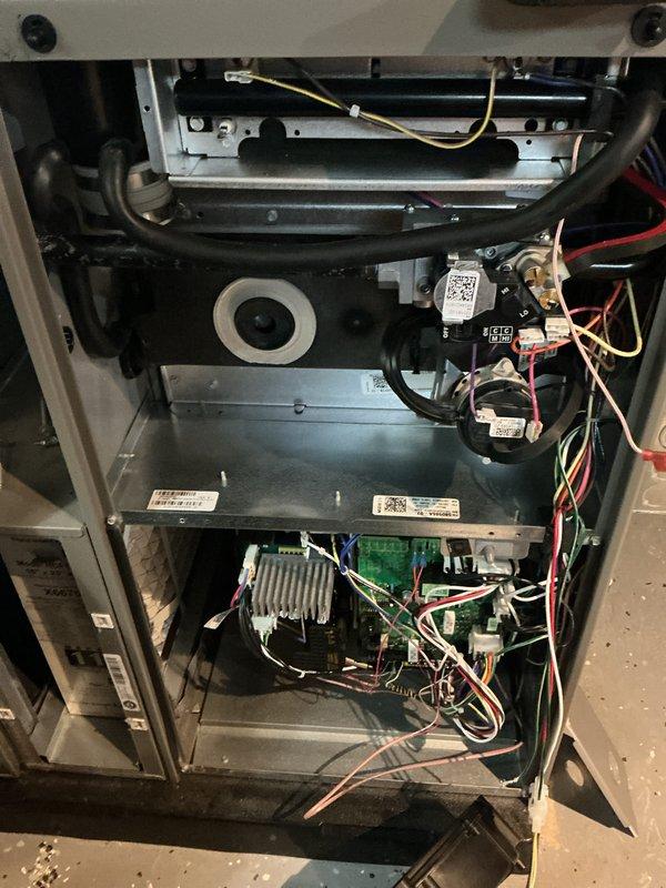 Completed annual furnace maintenance as part of air care membership program. Performed comprehensive tune-up including inspection of all internal components, blower assembly, control board, and wiring connections. Documented system condition with interior cabinet photos showing heat exchanger area, blower motor assembly, and electronic controls. Inspected air filter which showed normal dust accumulation from regular operation. Verified all electrical connections, safety controls, and burner components. System operational and ready for next heating season.
