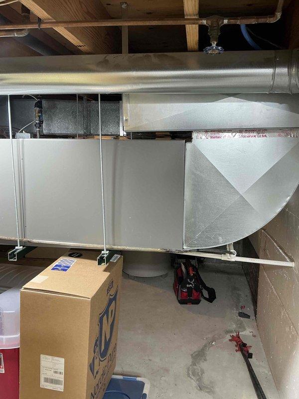 Performed estimate for complete AC system replacement on 10-year-old Lennox central air conditioning unit with complete refrigerant loss due to system leak. Evaluated existing air handling unit in basement and outdoor condensing unit installation, documented current system configuration including ductwork connections and drainage lines, and provided replacement options including warranty coverage information for new equipment installation.