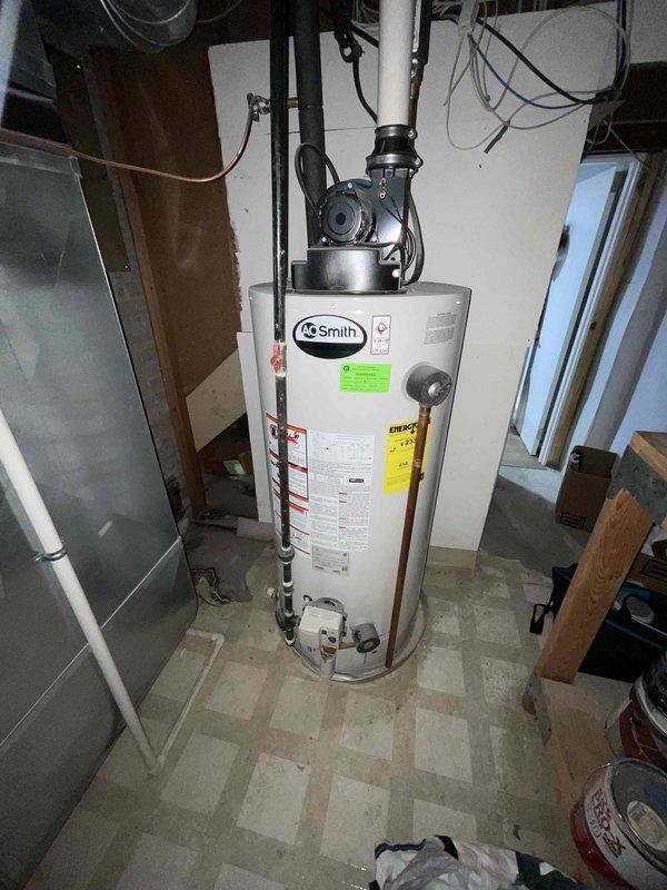 Conducted full system estimate for 16-year-old York HVAC system with confirmed refrigerant leak and complete cooling failure. Evaluated existing air conditioning unit, evaporator coil, and air handler in basement mechanical room to provide comprehensive replacement quote. Documented equipment condition and captured photographic evidence of current system configuration for replacement specifications.