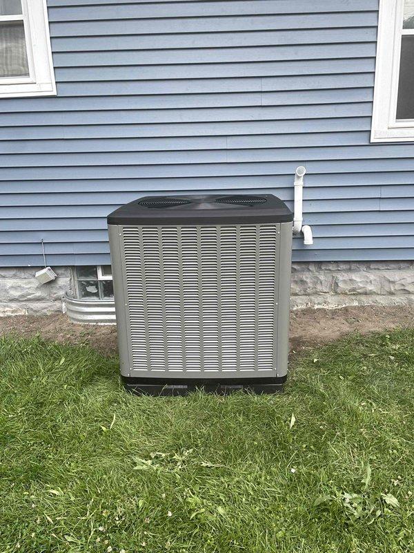 Completed full HVAC system installation including new Lennox furnace and air conditioning condenser unit. Installed furnace and air handler in basement utility area on concrete pad with proper clearances. Routed white PVC condensate drain and vent piping from furnace vertically through structure. Connected black refrigerant lines between indoor and outdoor units. Positioned outdoor condenser unit on ground-level pad against exterior wall with light blue vinyl siding. Installed white PVC condensate drain line along exterior wall. Connected all necessary electrical wiring and controls. Integrated system with existing ductwork infrastructure including overhead metallic foil-wrapped supply and return ducts. Verified all mechanical connections, tested system operation, and confirmed proper airflow. Installation completed per manufacturer specifications and local building codes. Permits were previously requested for this installation. All required financing documentation was completed on-sit