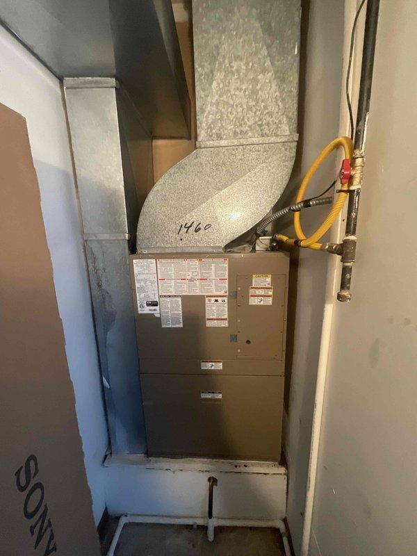 Provided estimate for replacement of 11-year-old non-functional Magic Pak combination furnace and air conditioning unit located in utility closet. Current equipment exhibited extensive rust damage and was no longer operational. Assessed installation requirements including existing ductwork configuration, gas line connections, and through-wall exterior venting for new system replacement.
