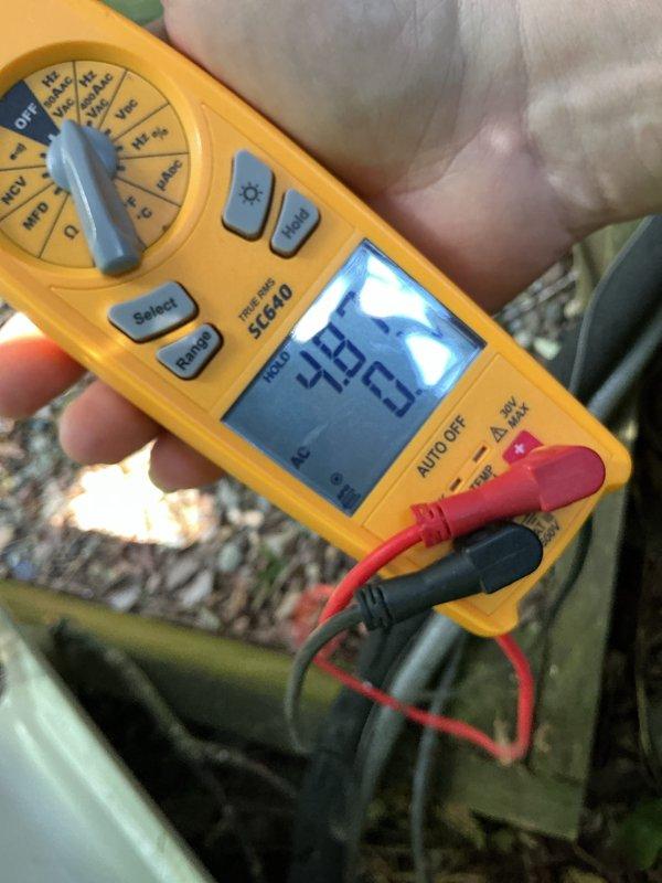 Completed routine maintenance on residential air conditioning unit. Performed system diagnostics and measured operating voltage at 48.63V to verify proper electrical function. Unit inspected and found operating within normal parameters.