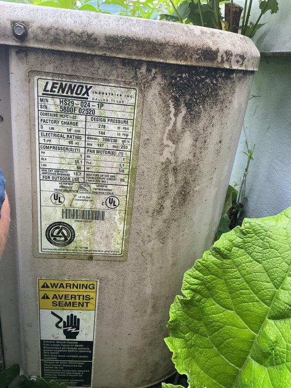 Responded to service call for air conditioning system experiencing intermittent operation with random starting and stopping. Upon arrival, inspected Lennox model HS29-024-1P condenser unit located in exterior landscaped area. Unit showed significant age with weathered exterior, dirt accumulation, and environmental exposure consistent with reported very old equipment age. Performed diagnostic evaluation of outdoor condenser unit to identify cause of intermittent cycling issue. Documented unit condition with photographs showing exterior wear, manufacturer specifications, and installation location against home foundation with electrical disconnect box. System assessed for electrical connections, component operation, and potential failure points causing erratic performance.