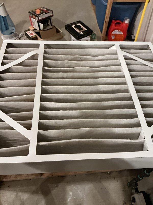 Completed annual HVAC maintenance inspection including filter replacement and system accessibility check. Removed heavily soiled pleated air filter showing significant dust accumulation and inspected attic-mounted equipment access point, verifying proper clearance and mechanical component accessibility. All system components inspected and found operational with no immediate service concerns identified.