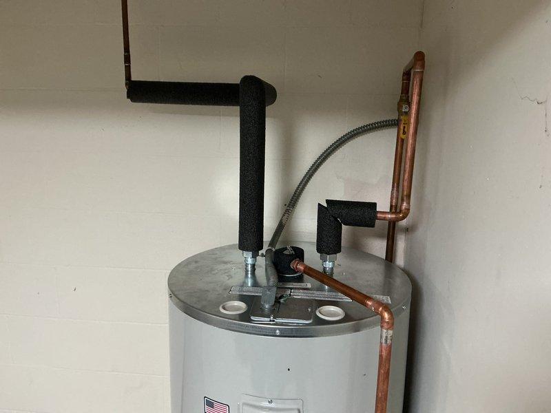 Completed full HVAC system installation including 70,000 BTU furnace, air conditioning unit, humidifier, and water heater in basement utility area. Obtained mechanical permits prior to installation and successfully reconnected all systems to operational status. Addressed water-damaged basement environment by coordinating with dehumidification equipment on-site during installation process.