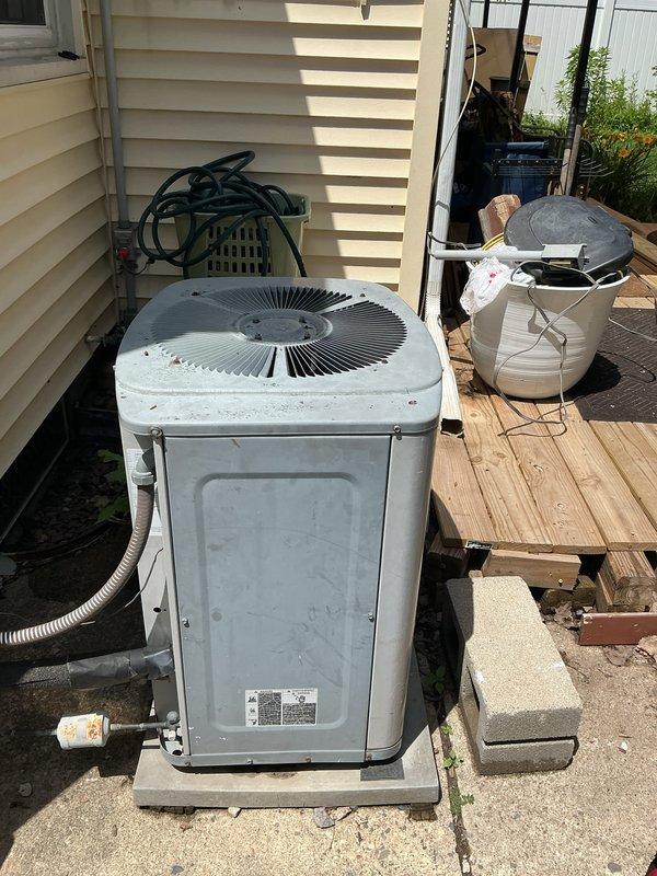 Responded to no-cool complaint on residential central air conditioning system. Upon arrival, confirmed condenser unit would not start—compressor and fan motor attempted to engage but failed, producing clicking sound. Diagnosed failed dual run capacitor preventing both compressor and condenser fan motor from starting properly. Replaced defective capacitor with properly rated component. Tested system operation; compressor started immediately, condenser fan reached full speed, and unit cooled normally. System restored to full operation.