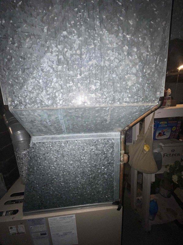 Provided comprehensive estimate for complete HVAC system replacement including air conditioning unit, furnace, and water heater in basement location. Current 30-year-old air conditioning system is non-operational while existing furnace remains functional. Assessed existing galvanized sheet metal ductwork system running vertically and horizontally throughout basement utility area, evaluated copper refrigerant lines, and documented current equipment configuration and installation conditions for replacement specifications.
