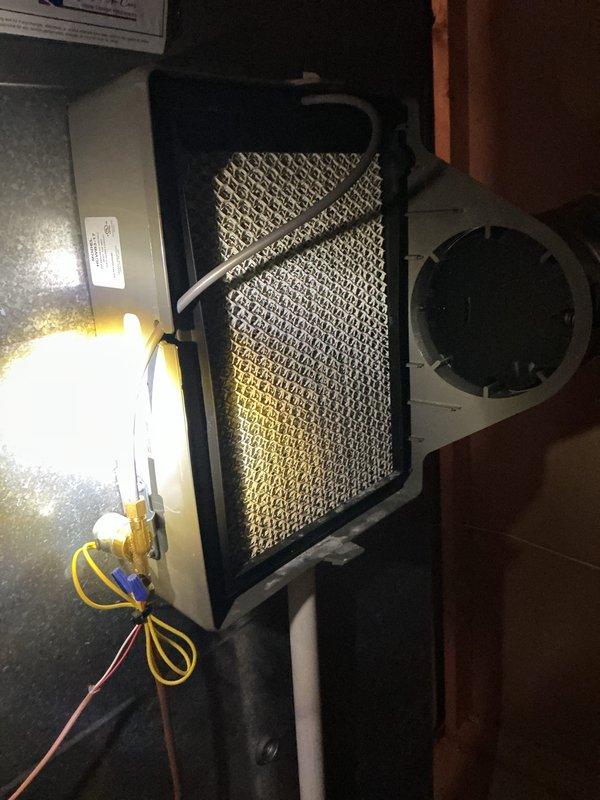 Completed routine air conditioning maintenance on residential AC system. Performed comprehensive inspection of evaporator coil assembly and blower housing, noting moderate dust and debris accumulation on coil surface with visible golden-brown discoloration concentrated in center and lower sections. Replaced dirty pleated air filter showing significant dust loading and discoloration. Verified all electrical connections and wiring secure. System operational with no mechanical issues identified at time of service.