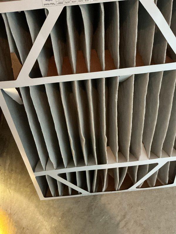 Completed routine air conditioning maintenance on residential AC system. Performed comprehensive inspection of evaporator coil assembly and blower housing, noting moderate dust and debris accumulation on coil surface with visible golden-brown discoloration concentrated in center and lower sections. Replaced dirty pleated air filter showing significant dust loading and discoloration. Verified all electrical connections and wiring secure. System operational with no mechanical issues identified at time of service.