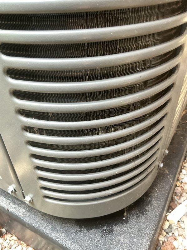 Responded to callback regarding condenser coil condition following previous fuse replacement service. Performed visual inspection of outdoor unit and documented coil condition with photographs. Upon examination, condenser coils showed normal weathering and dirt accumulation consistent with outdoor exposure, but no structural damage or compromised fins were observed that would affect system operation or efficiency.