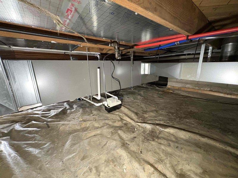 Completed full HVAC system installation in crawl space including 70,000 BTU gas furnace and 2-ton air conditioning unit with rear discharge configuration. Installed new dedicated electrical circuit to support system requirements and secured all necessary mechanical and electrical permits prior to installation. System installed over existing vapor barrier with proper clearances maintained from structural elements and insulation, verified all electrical specifications and safety ratings, and ensured compliance with residential installation codes.