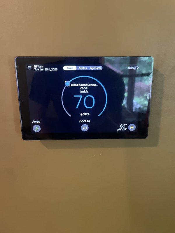 Completed installation of 5-ton air conditioning system with matching evaporator coil in left-side configuration. Reconnected electrical service and verified proper operation of condensate pump system in basement location. Programmed and tested Lennox digital thermostat, confirming cooling cycle operation, humidity monitoring, and zone control functionality at 70-degree setpoint.