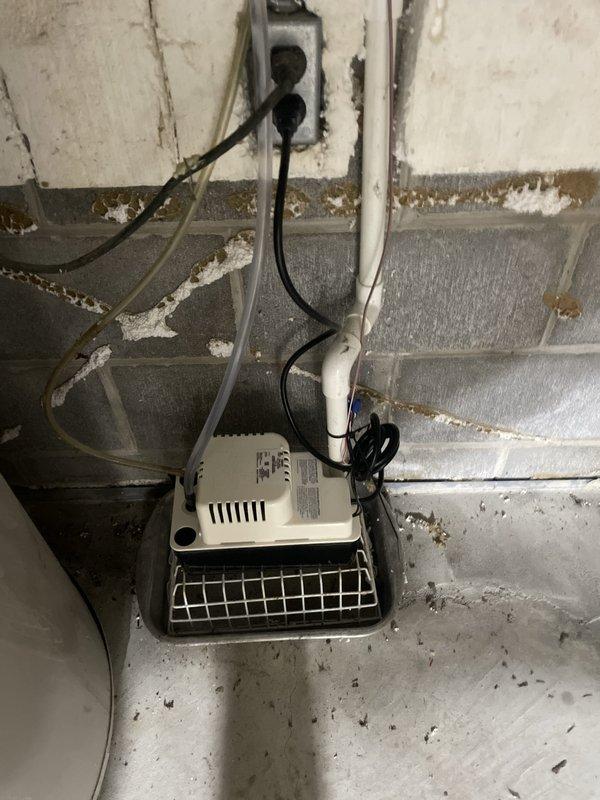 Completed installation of 5-ton air conditioning system with matching evaporator coil in left-side configuration. Reconnected electrical service and verified proper operation of condensate pump system in basement location. Programmed and tested Lennox digital thermostat, confirming cooling cycle operation, humidity monitoring, and zone control functionality at 70-degree setpoint.