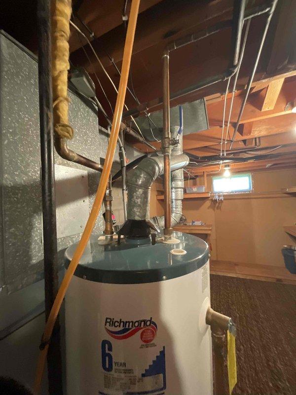 Conducted residential estimate for complete HVAC system replacement including 20-year-old furnace and 9-year-old air conditioning unit. Inspected existing equipment in basement utility area, documented current system configuration with furnace and air handler positioned side-by-side with metallic ductwork connections. Provided replacement options and discussed available promotional offerings for simultaneous furnace and AC installation.