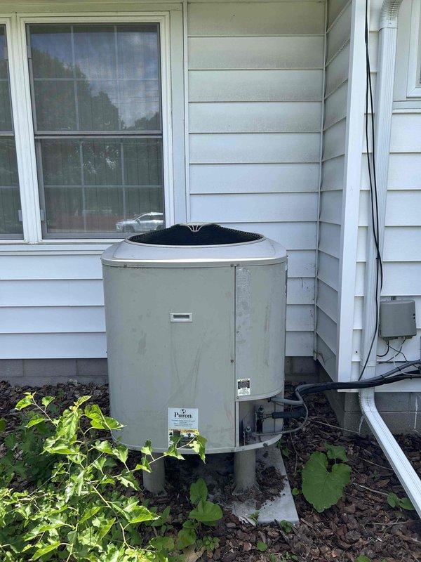 Responded to no-cool complaint on residential air conditioning system. Upon arrival, performed complete system diagnostic including inspection of both indoor furnace/air handler unit and outdoor condenser unit. Verified electrical power supply at disconnect box, checked thermostat operation and settings, and inspected all accessible components for obvious failures or damage. Examined indoor unit blower assembly, control boards, wiring harnesses, and condensate drainage system - all appeared functional with no visible signs of failure or deterioration. Proceeded to outdoor condenser unit where inspected compressor, fan motor, capacitor connections, and refrigerant line sets. Noted vegetation growth around condenser base affecting clearance requirements. Both units showed no obvious mechanical failures, damaged components, or electrical issues during visual inspection. System appeared to be properly maintained with components in serviceable condition. Documented equipment condition with 