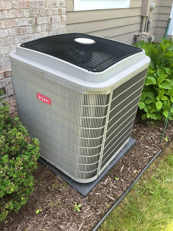 Completed spring maintenance tune-up on Bryant central air conditioning system. Performed comprehensive inspection of outdoor condenser unit, cleaned condenser coils showing significant dirt and debris accumulation on one side, checked refrigerant levels, tested electrical connections, and verified proper system operation. Unit is functioning correctly with no issues identified; system left in optimal condition for cooling season.