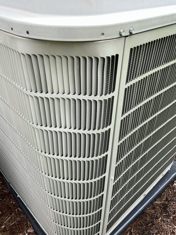 Completed spring maintenance tune-up on Bryant central air conditioning system. Performed comprehensive inspection of outdoor condenser unit, cleaned condenser coils showing significant dirt and debris accumulation on one side, checked refrigerant levels, tested electrical connections, and verified proper system operation. Unit is functioning correctly with no issues identified; system left in optimal condition for cooling season.