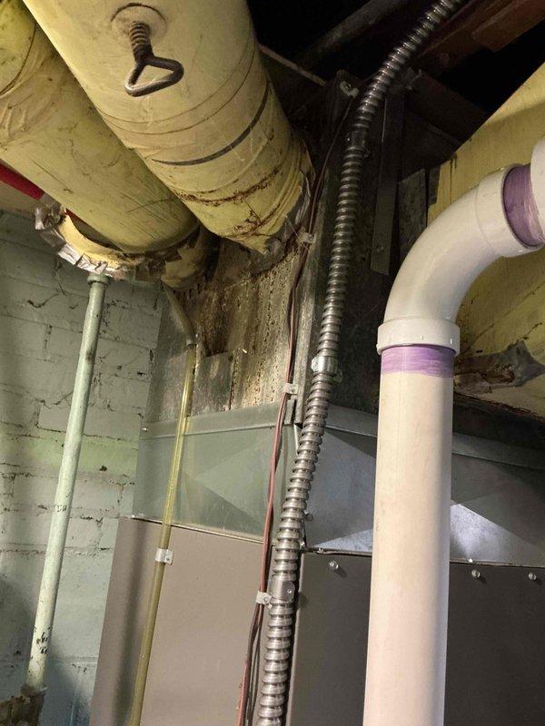 Completed electrical estimate for new whole home generator installation. Assessed existing utility room infrastructure including water heater location, overhead ductwork, electrical conduit routing, and available space for generator placement. Documented current mechanical systems, PVC venting configuration, and HVAC components to determine optimal generator positioning and required electrical service upgrades for seamless integration with home's existing systems.