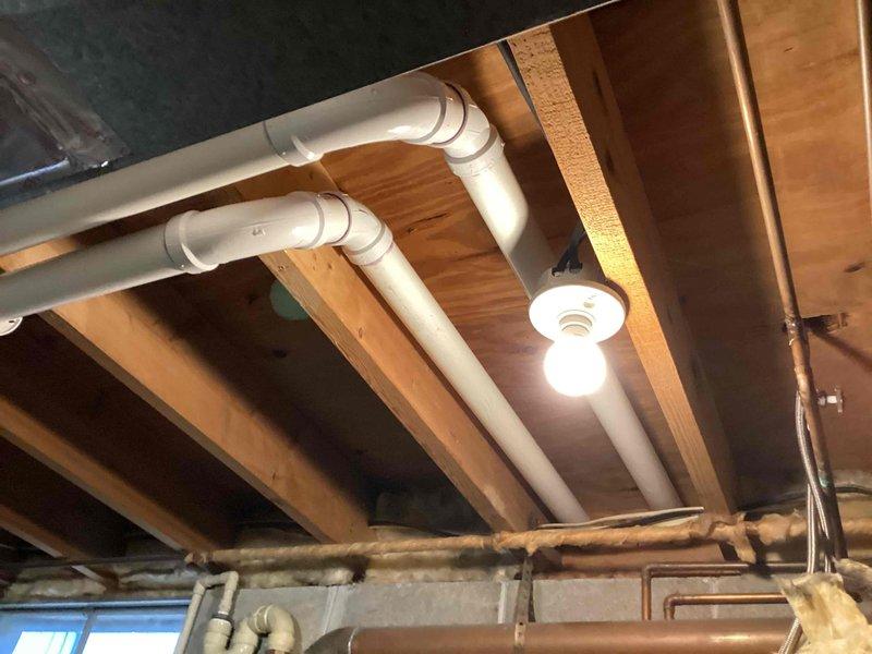 Completed full HVAC system installation including a 90,000 BTU furnace with humidifier and 3.5-ton air conditioning unit with rear discharge configuration. All equipment was installed per manufacturer specifications, with PVC venting routed through basement ceiling joists and condensate drainage properly configured. The Lennox condenser was positioned on a protective pad with paver stone base against exterior wall, with all refrigerant lines connected and electrical reconnection completed. Mechanical permit was obtained prior to installation, and all work was performed in compliance with local building codes and industry standards.