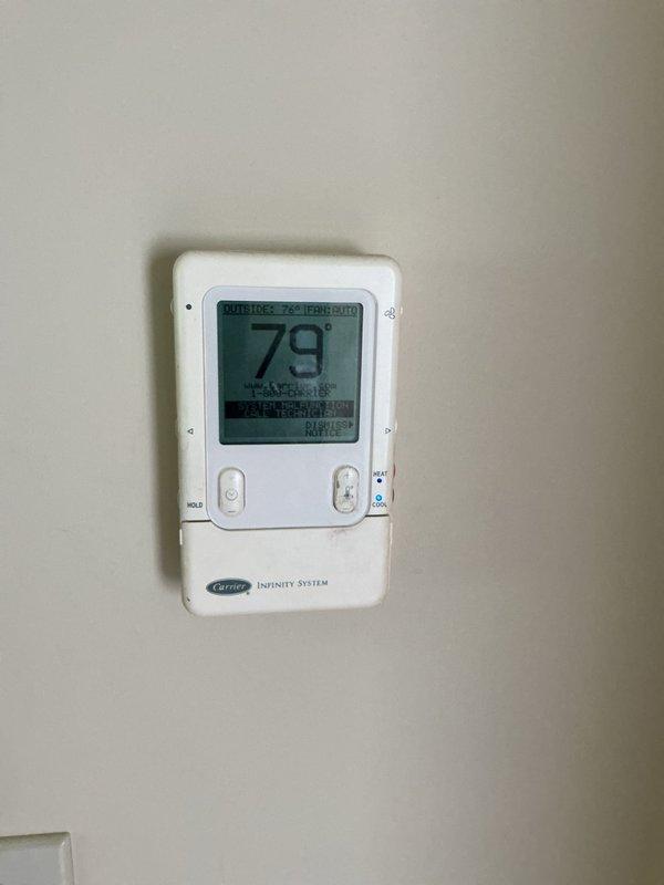 Responded to no cooling complaint with weak airflow and unresponsive Carrier Infinity thermostat. Diagnosed 10+ year old outdoor condenser unit and thermostat system, identifying communication failure between thermostat and air handler preventing temperature adjustment and proper system operation. Restored cooling functionality and verified thermostat control response.