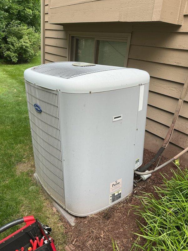 Responded to no cooling complaint with weak airflow and unresponsive Carrier Infinity thermostat. Diagnosed 10+ year old outdoor condenser unit and thermostat system, identifying communication failure between thermostat and air handler preventing temperature adjustment and proper system operation. Restored cooling functionality and verified thermostat control response.