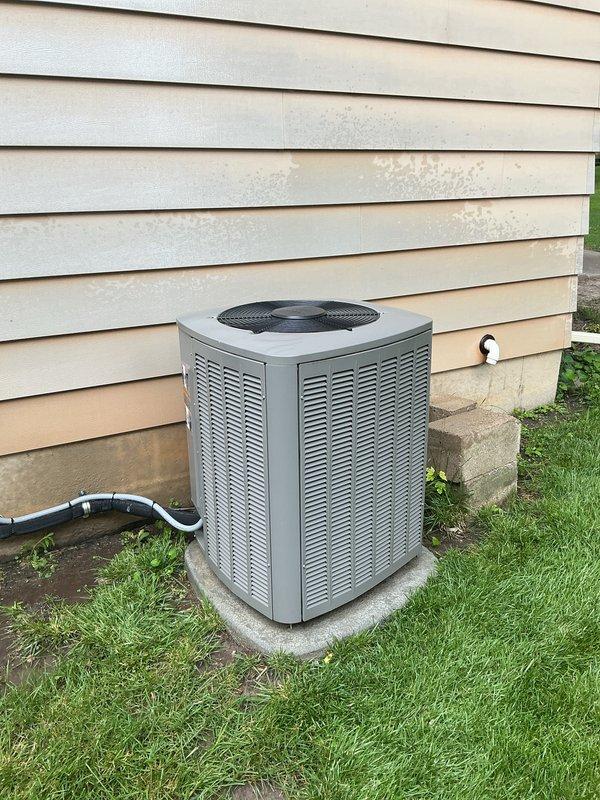 Completed annual cooling maintenance on residential split system air conditioning unit. Performed comprehensive inspection of outdoor condenser unit, verified proper operation of fan motor and compressor, checked refrigerant levels, and cleaned condenser coils. Replaced furnace filter and humidifier pad as part of scheduled preventive maintenance. All components operating within normal parameters upon completion of service visit.