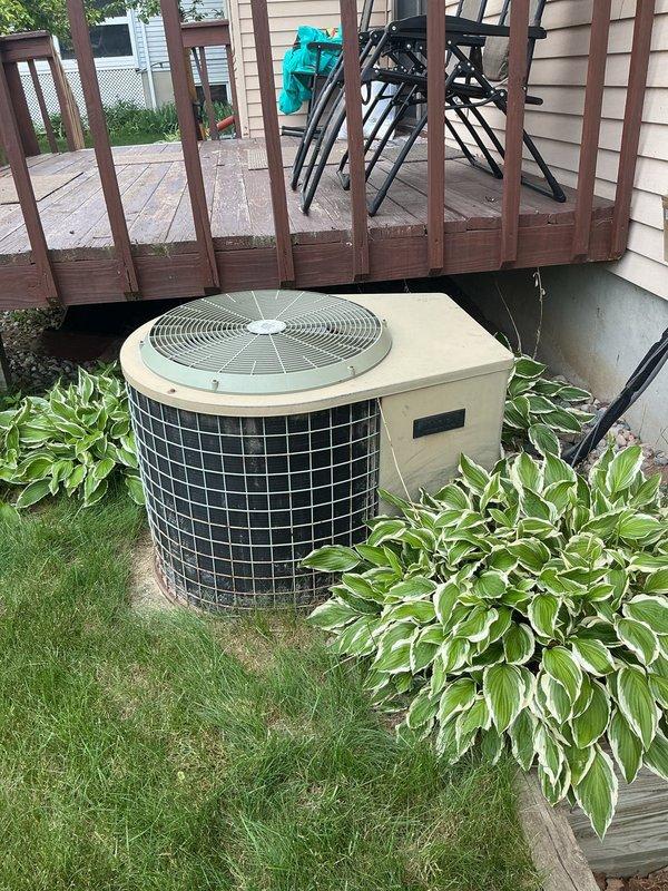 Responded to no cooling complaint on central air conditioning system. Upon arrival, found outdoor condenser unit with inoperative fan motor producing humming sound, indicating electrical failure or seized motor bearings. Diagnosed failed condenser fan motor on 6-9 year old residential split system AC unit. Replaced defective fan motor with OEM equivalent component, verified proper rotation and airflow. Tested capacitor and contactor operation, confirmed proper amperage draw and system pressures. Unit restored to full cooling operation with normal sound levels.