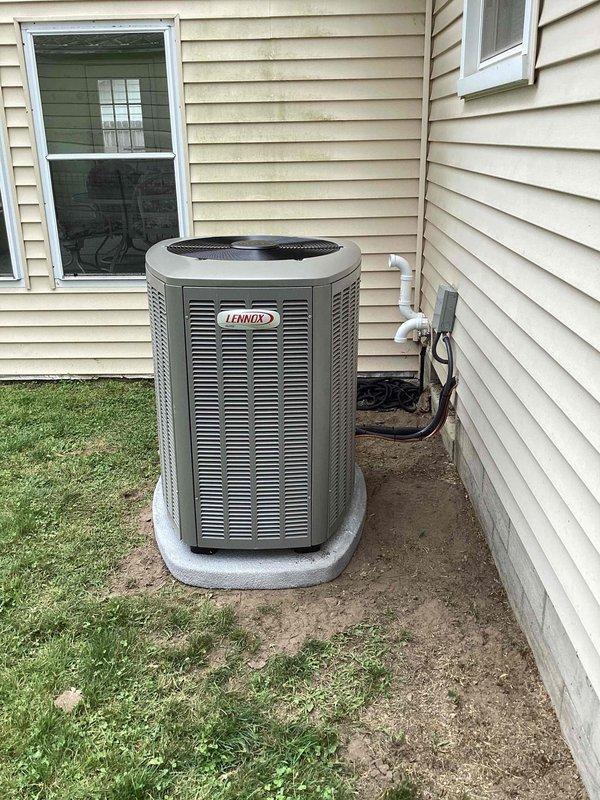Completed full HVAC system installation including 70,000 BTU furnace, 2-ton air conditioning unit, and evaporator coil as per Option 3 specifications. Installed Lennox brand outdoor condenser unit on composite base pad against exterior wall with proper electrical disconnect and conduit routing. Reconnected all necessary refrigerant lines, electrical connections, and ductwork to ensure system integration. Verified proper startup operation, airflow, and system performance upon completion.