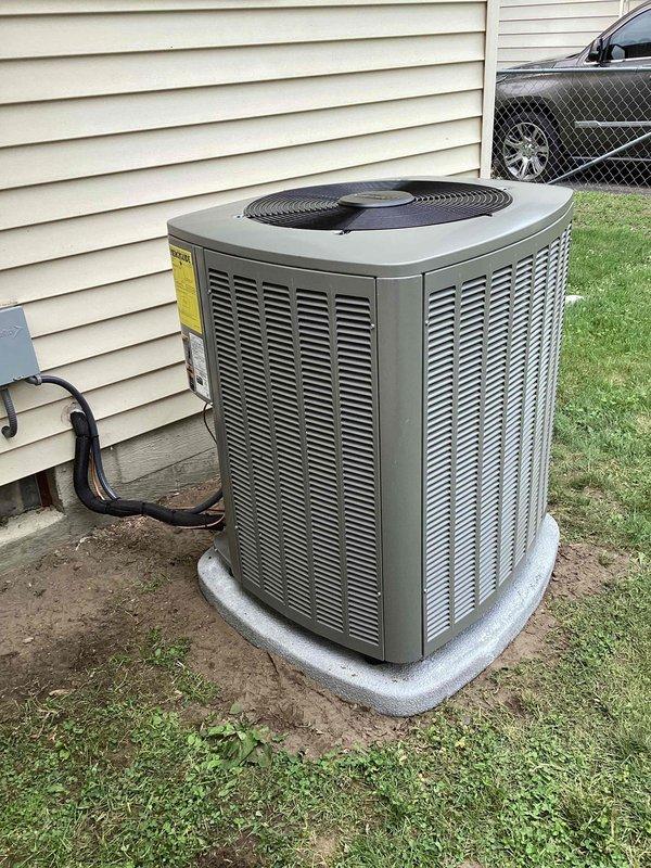 Completed full HVAC system installation including 70,000 BTU furnace, 2-ton air conditioning unit, and evaporator coil as per Option 3 specifications. Installed Lennox brand outdoor condenser unit on composite base pad against exterior wall with proper electrical disconnect and conduit routing. Reconnected all necessary refrigerant lines, electrical connections, and ductwork to ensure system integration. Verified proper startup operation, airflow, and system performance upon completion.