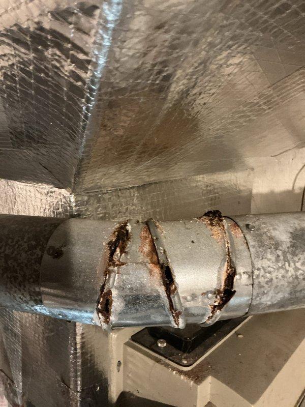 Responded to no heat call on 30-year-old forced air furnace system. Upon arrival, accessed property through garage entrance as directed and found homeowner present. Conducted thorough diagnostic inspection of furnace and ductwork system in basement utility area. Documented extensive rust corrosion on heat exchanger components and duct connectors, indicating significant age-related deterioration and moisture damage throughout the system. Photographed compromised metallic components showing heavy oxidation and structural degradation. Based on the age of the equipment and severity of corrosion observed, advised homeowner that the furnace has reached end of serviceable life and replacement is necessary for safe operation. System deemed unsafe to operate due to potential heat exchanger failure risks. Provided customer with options and recommendations for new equipment installation.