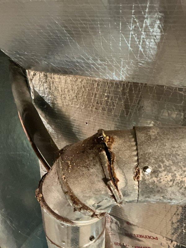 Responded to no heat call on 30-year-old forced air furnace system. Upon arrival, accessed property through garage entrance as directed and found homeowner present. Conducted thorough diagnostic inspection of furnace and ductwork system in basement utility area. Documented extensive rust corrosion on heat exchanger components and duct connectors, indicating significant age-related deterioration and moisture damage throughout the system. Photographed compromised metallic components showing heavy oxidation and structural degradation. Based on the age of the equipment and severity of corrosion observed, advised homeowner that the furnace has reached end of serviceable life and replacement is necessary for safe operation. System deemed unsafe to operate due to potential heat exchanger failure risks. Provided customer with options and recommendations for new equipment installation.