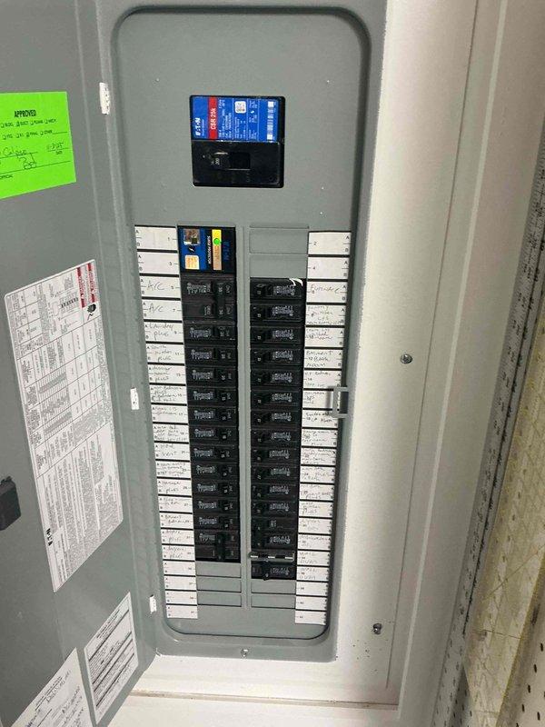 Conducted on-site evaluation for Level 2 electric vehicle charging station installation at a residential single-family home. Inspected existing electrical panel to assess capacity and available breaker positions for dedicated 240V circuit required for EV charger. Documented panel configuration showing adequate space for new circuit installation, with digital monitoring device present at main breaker position. Provided estimate for installation of Level 2 charging equipment in garage, including necessary electrical materials, conduit, wiring, and GFCI-protected dedicated circuit per NEC requirements.