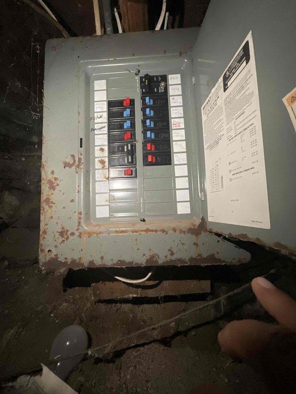 Conducted comprehensive assessment of existing 25-year-old forced air furnace system located in basement for full replacement estimate. Evaluated current heating infrastructure and determined requirements for complete HVAC system upgrade including new furnace installation and addition of central air conditioning, as property currently has no AC system. Documented existing equipment condition, ductwork configuration, electrical service panel with noted corrosion concerns at lower section, and utility connections including water heater proximity in mechanical space. Photographed electrical panel showing rust deterioration requiring attention during installation, assessed available space for new outdoor condensing unit placement, and verified basement layout for optimal equipment positioning. Provided detailed estimate for complete forced air furnace replacement and new central air conditioning system installation to be completed prior to heating season.