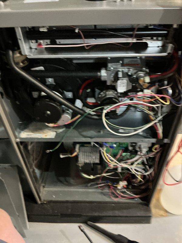 Completed annual maintenance on 1-year-old forced air furnace and air conditioning system. Performed comprehensive AC tune-up including inspection of all internal components, electrical connections, gas valve assembly, ignition system, and control boards. Verified proper operation of blower motor, pressure switches, and burner assembly. Inspected and tested all wiring connections including transformer and control modules. Checked intake and exhaust venting systems for proper function. Cleaned accessible components and confirmed system is operating within manufacturer specifications. Both heating and cooling systems tested and found to be functioning properly with no issues identified.