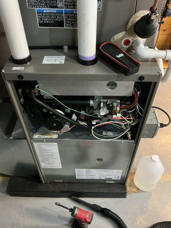 Completed annual maintenance on 1-year-old forced air furnace and air conditioning system. Performed comprehensive AC tune-up including inspection of all internal components, electrical connections, gas valve assembly, ignition system, and control boards. Verified proper operation of blower motor, pressure switches, and burner assembly. Inspected and tested all wiring connections including transformer and control modules. Checked intake and exhaust venting systems for proper function. Cleaned accessible components and confirmed system is operating within manufacturer specifications. Both heating and cooling systems tested and found to be functioning properly with no issues identified.