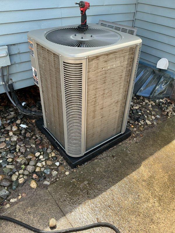 Completed annual cooling maintenance on residential air conditioning system. Performed comprehensive inspection of outdoor condenser unit, noting heavily soiled condenser coil requiring cleaning attention. Accessed electrical compartment to inspect capacitor, contactor, and wiring connections. Documented equipment condition through photographic documentation showing significant dirt and debris accumulation on coil surfaces that could impact system efficiency and airflow if not addressed during future service intervals.
