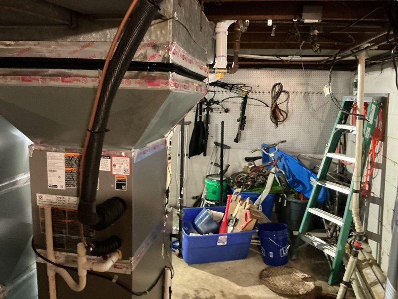 Completed full HVAC system installation in basement utility room, including 70,000 BTU furnace, 2-ton air conditioning unit, and evaporator coil. All equipment properly positioned, secured, and connected to existing ductwork with flexible transitions. System reconnected to electrical service and tested for proper operation upon completion.