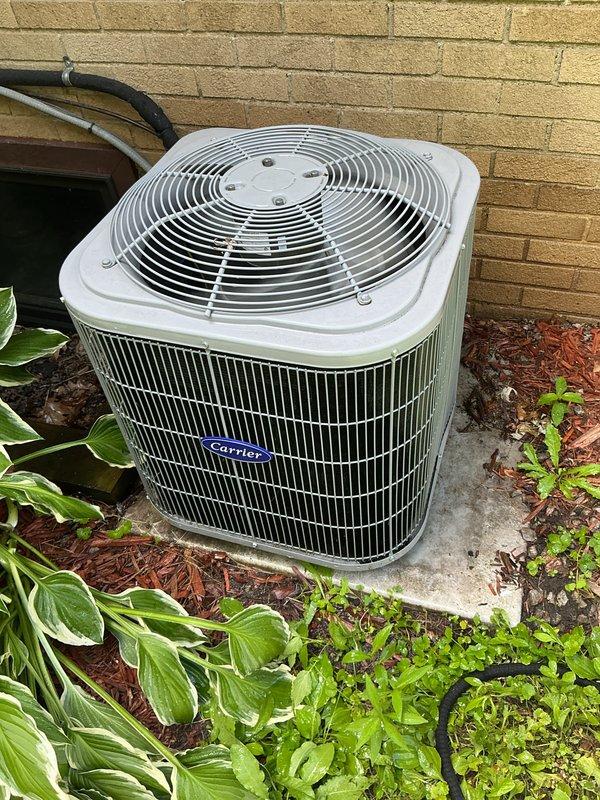 Completed annual cooling maintenance on Carrier air conditioning system. Inspected outdoor condenser unit, cleaned condenser coil fins to remove accumulated dirt and debris, replaced air filters, and checked evaporator pad. Unit operating within normal parameters upon completion of preventive maintenance service.