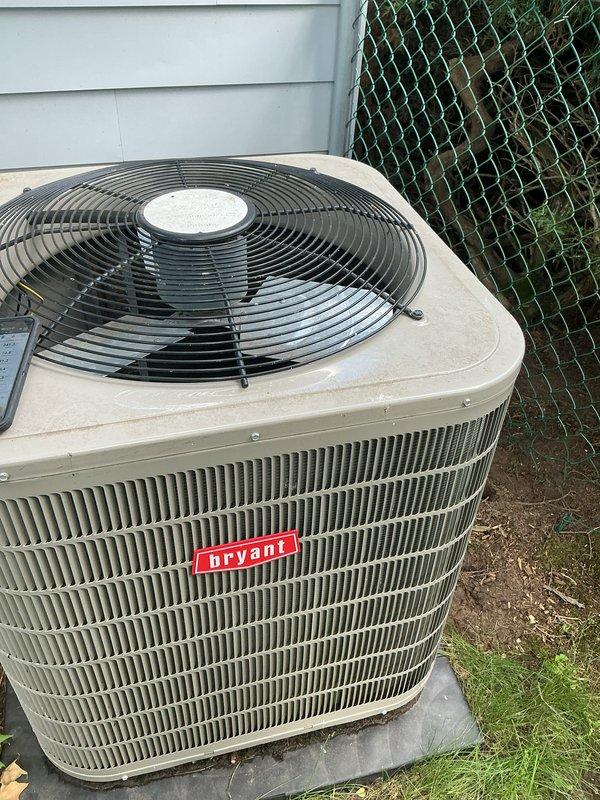Completed routine maintenance on Bryant central air conditioning system. Inspected outdoor condenser unit, verified proper operation of compressor and condenser fan, and checked refrigerant levels. Serviced indoor air handler, noting dirty mesh filter which was cleaned to restore proper airflow and system efficiency.