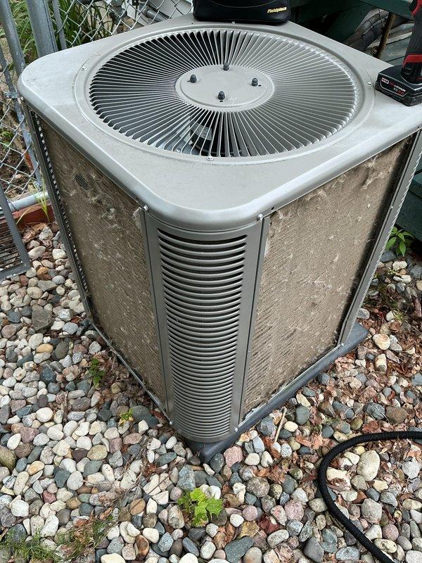 Completed comprehensive 5-year ComfortGuard maintenance visit on residential cooling system. Performed full system inspection of outdoor condenser unit, which showed normal weathering and operational wear consistent with age. Replaced air filter and evaporative cooler pad as requested. Conducted electrical diagnostics using digital multimeter to verify proper voltage, amperage, and system performance parameters. All measurements within manufacturer specifications. Unit operating efficiently with no immediate service concerns identified.
